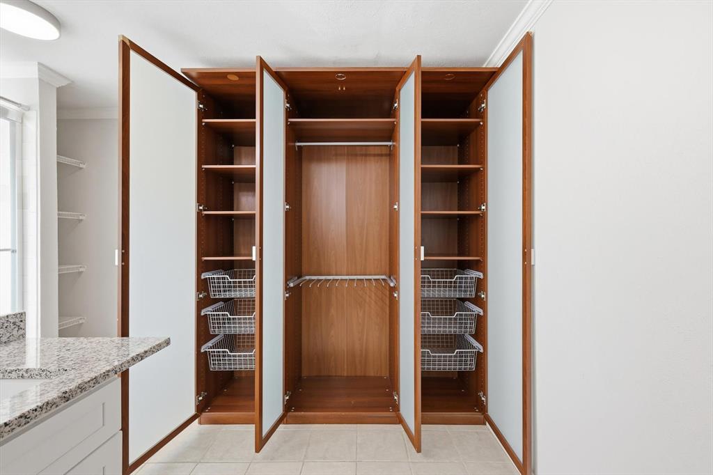 4020 Windhaven Lane Dallas, TX 75287 - Photo 17 of 32 a view of walk in closet with empty racks