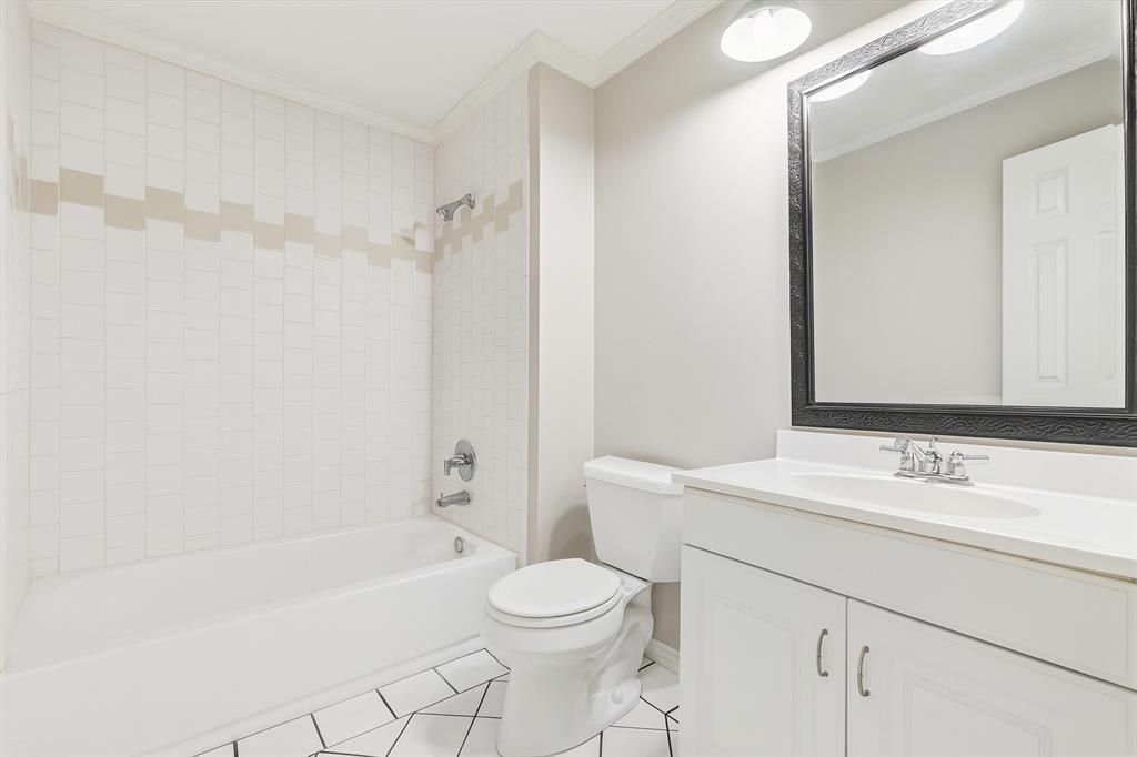 4020 Windhaven Lane Dallas, TX 75287 - Photo 20 of 32 a bathroom with a sink toilet and shower