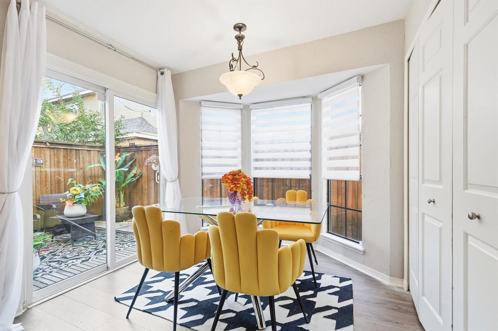 4020 Windhaven Lane Dallas, TX 75287 - Photo 2 of 32 a view of a dining room with furniture window and wooden floor