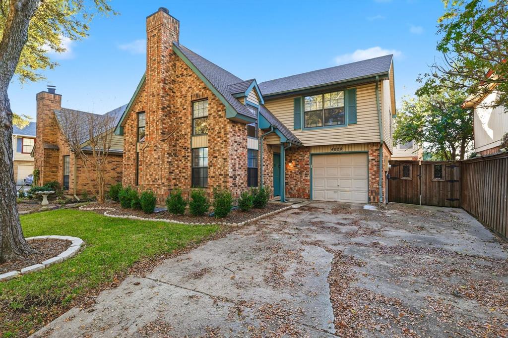 4020 Windhaven Lane Dallas, TX 75287 - Photo 30 of 32 a front view of a house with garden