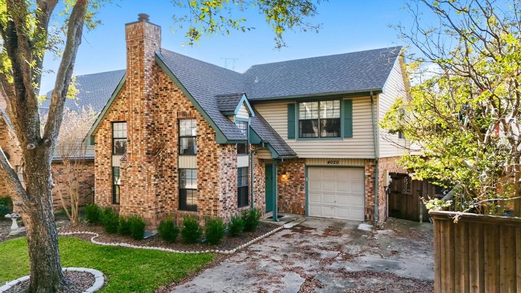 4020 Windhaven Lane Dallas, TX 75287 - Photo 4 of 32 front view of a house with a yard