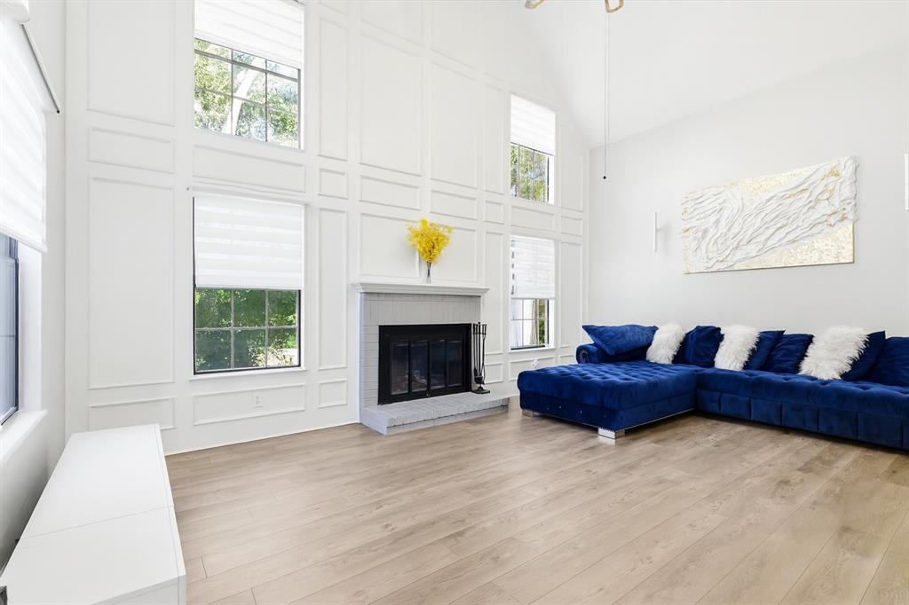 4020 Windhaven Lane Dallas, TX 75287 - Photo 5 of 32 a living room with furniture and a fireplace