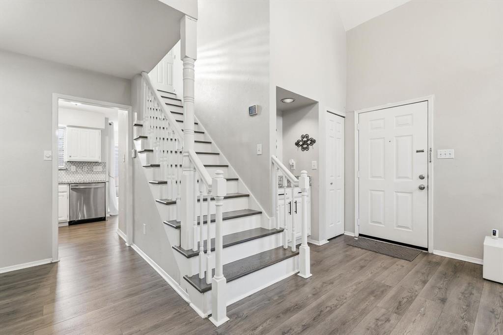 4020 Windhaven Lane Dallas, TX 75287 - Photo 8 of 32 a view of entryway with stairs and wooden floor