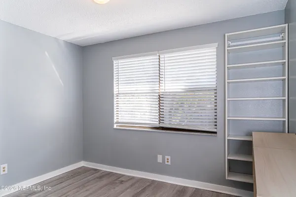 a view of an empty room with a window