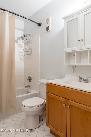 a bathroom with a toilet a sink and bathtub