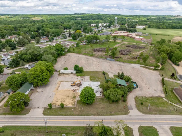 an aerial view of residential houses with outdoor space