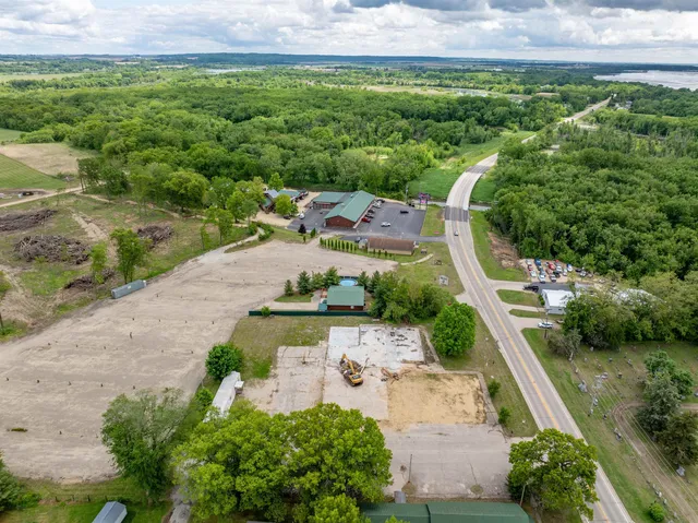 a view of a street with a garden