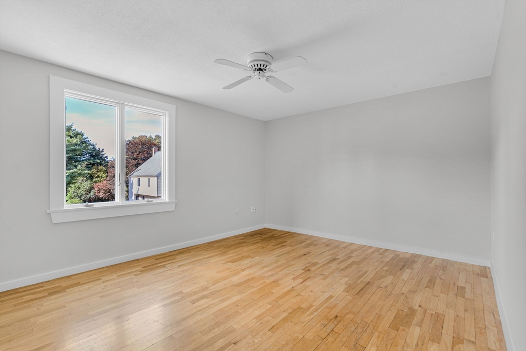 403 Great Road, Unit 5 Acton, MA 01720 - Photo 19 of 25 a view of an empty room with a window