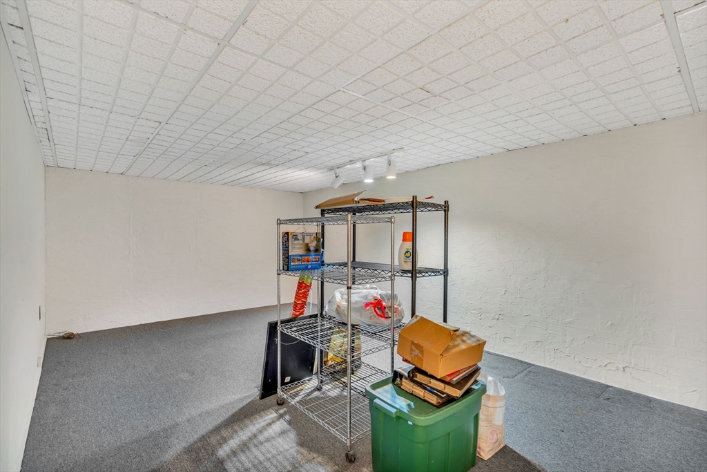 403 Great Road, Unit 5 Acton, MA 01720 - Photo 22 of 25 a room with furniture and rug