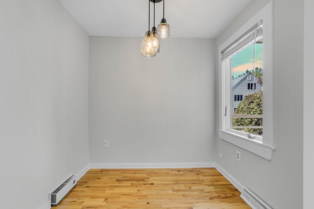 403 Great Road, Unit 5 Acton, MA 01720 - Photo 9 of 25 a view of empty room with window