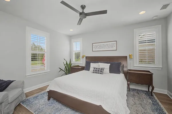 a bed sitting in a bedroom next to a window