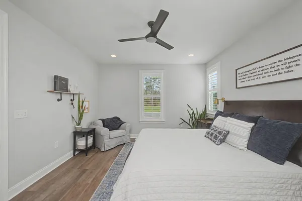 a bedroom with a bed furniture and a window
