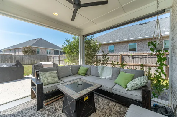 a backyard of house with wooden fence