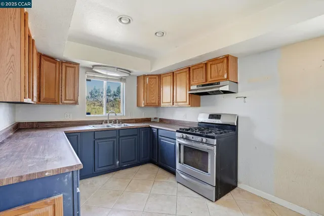 a kitchen with cabinets a window and a sink