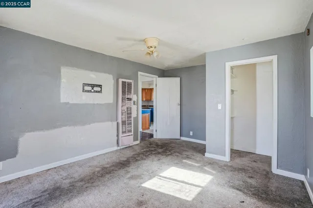 a view of livingroom with hardwood floor and ceiling fan