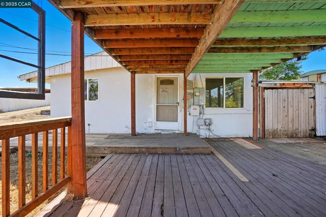 a porch with wooden floor