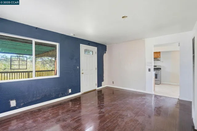 a view of an empty room with a window