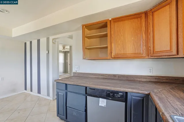 a view of a kitchen cabinets and a counter top space