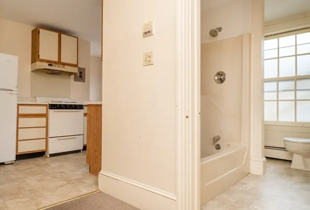 a bathroom with a bathtub and a shower