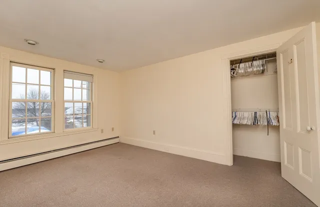 an empty room with a empty space and a window