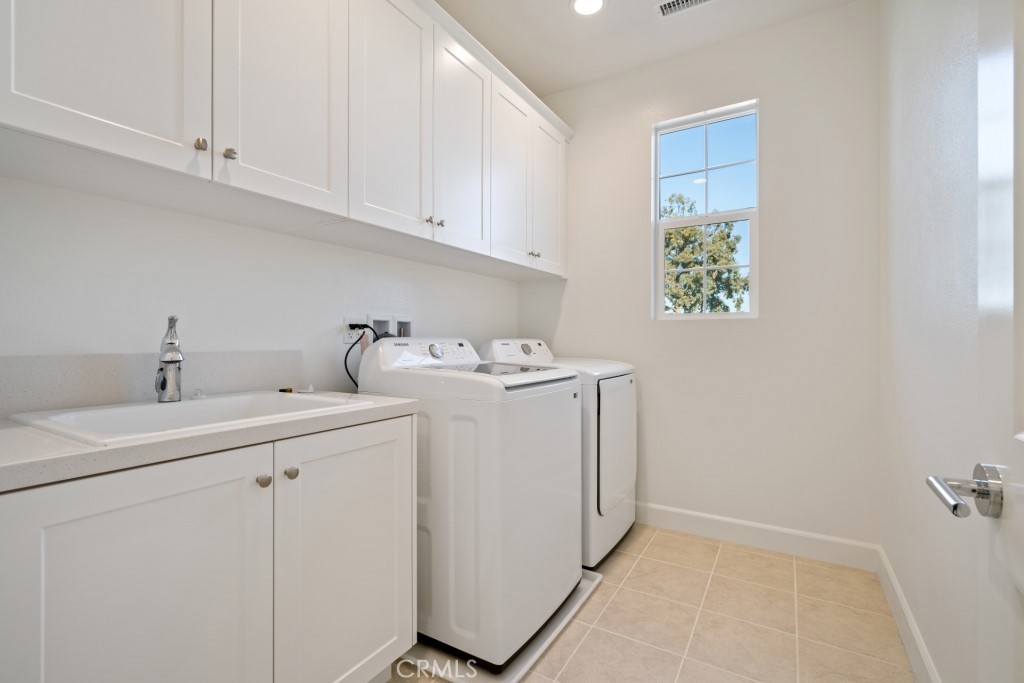 1211 Providence Loop Placentia, CA 92870 - Photo 13 of 20 a utility room with dryer and washer