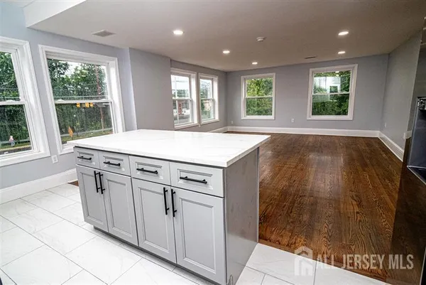 a kitchen with a sink and large window