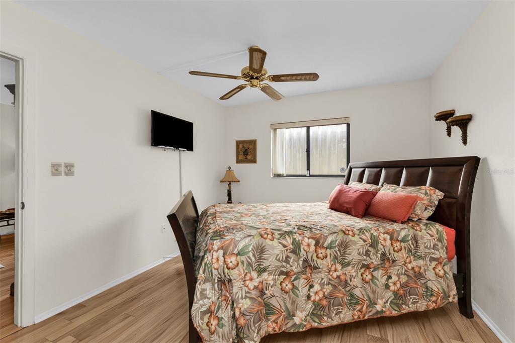 25225 Rampart Boulevard, Unit 1604 Punta Gorda, FL 33983 - Photo 17 of 41 a bedroom with a bed and a flat screen tv