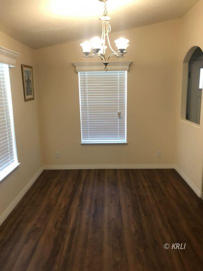 5651 South Kelso Valley Road Weldon, CA 93283 - Photo 18 of 34 a view of wooden floor chandelier and windows in a room