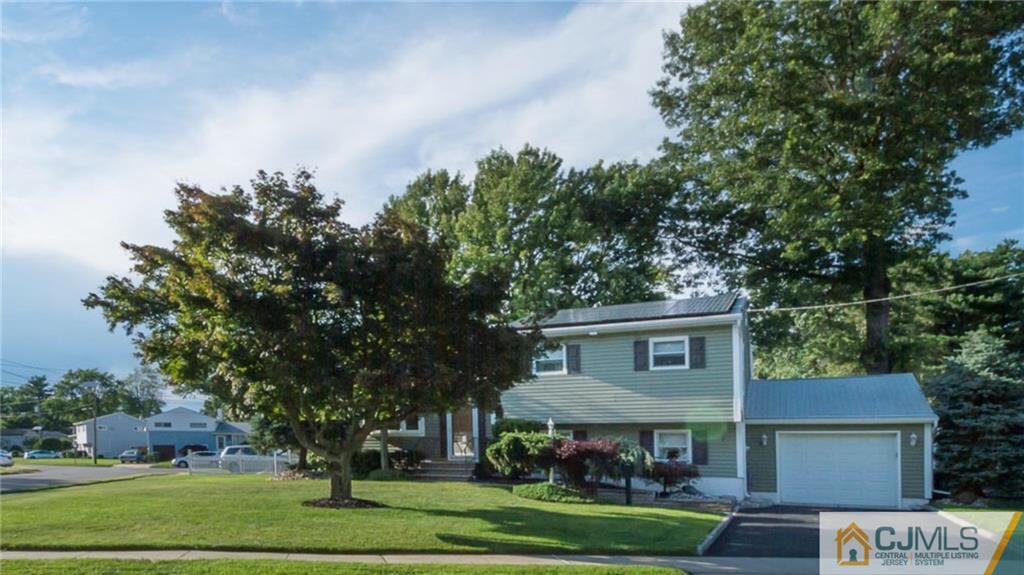 15 Eastlick Road Edison, NJ 08817 - Photo 2 of 23 a view of house with a big yard and large trees