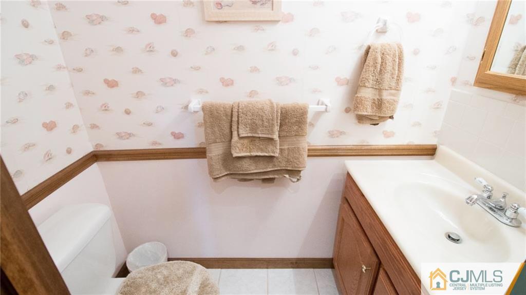 15 Eastlick Road Edison, NJ 08817 - Photo 12 of 23 a bathroom with a sink and a mirror