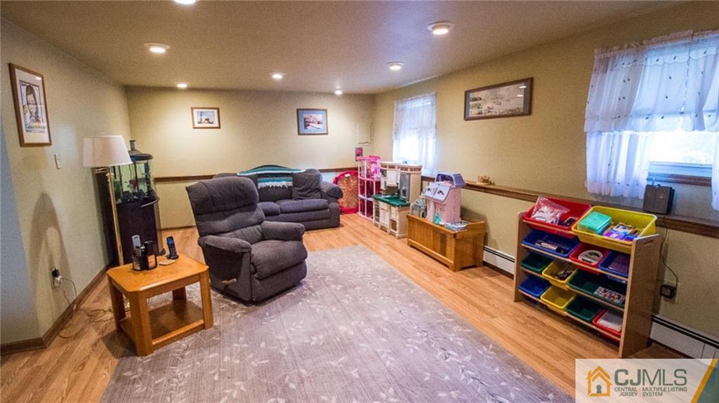 15 Eastlick Road Edison, NJ 08817 - Photo 13 of 23 a living room with furniture and a flat screen tv