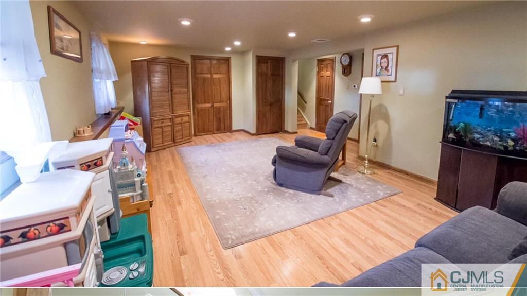15 Eastlick Road Edison, NJ 08817 - Photo 14 of 23 a living room with furniture and a wooden floor