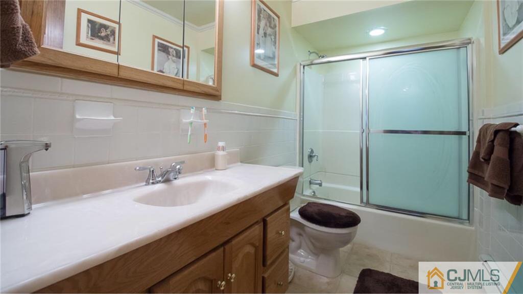 15 Eastlick Road Edison, NJ 08817 - Photo 15 of 23 a bathroom with a sink a toilet and shower