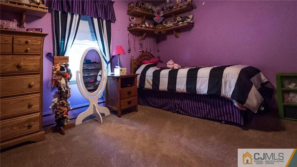 15 Eastlick Road Edison, NJ 08817 - Photo 19 of 23 a view of a room with gym equipment