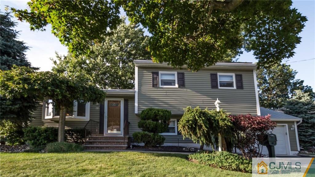15 Eastlick Road Edison, NJ 08817 - Photo 3 of 23 a house view with a garden space
