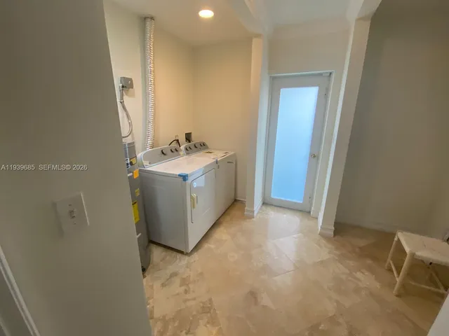 a view of a bathroom with a sink and mirror