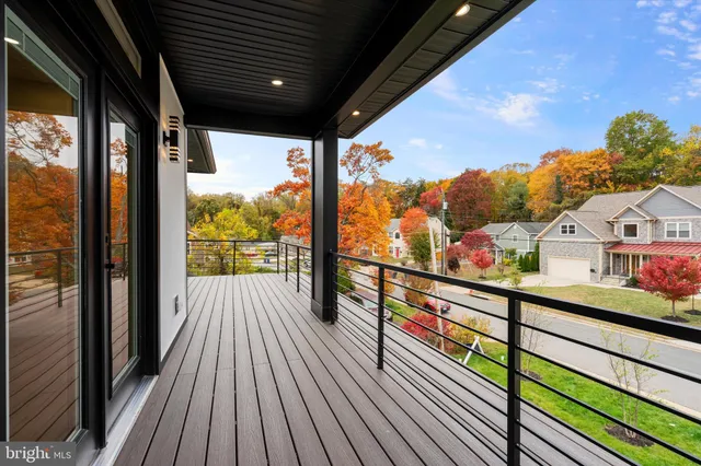 a view of a balcony with wooden floor
