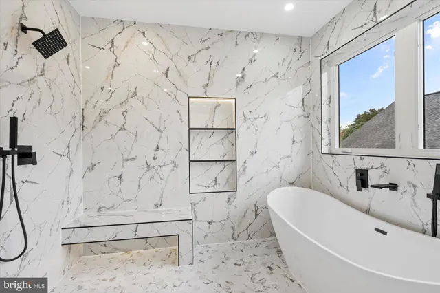 a bathroom with a bathtub and shower