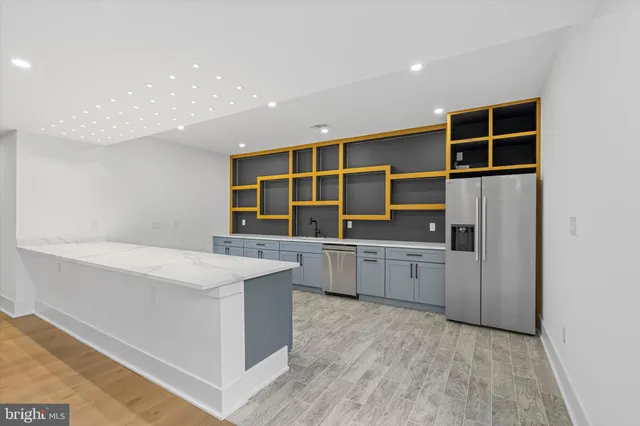a kitchen with counter top space cabinets and stainless steel appliances