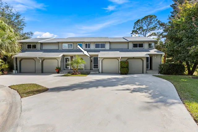 a view of a kitchen with furniture and a ceiling fan