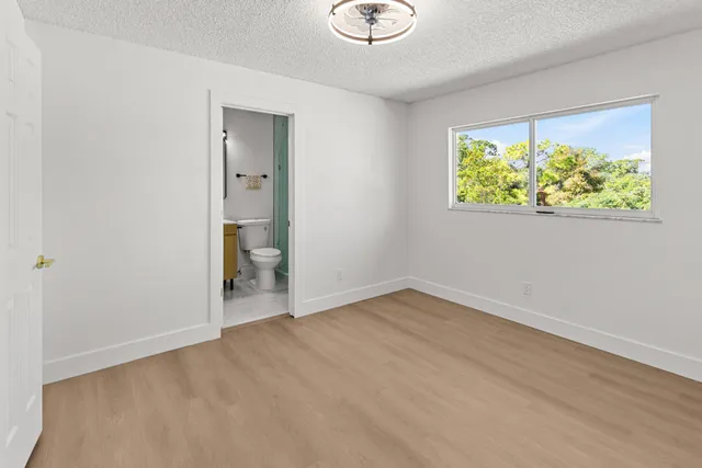 a sign broad in front of flowers