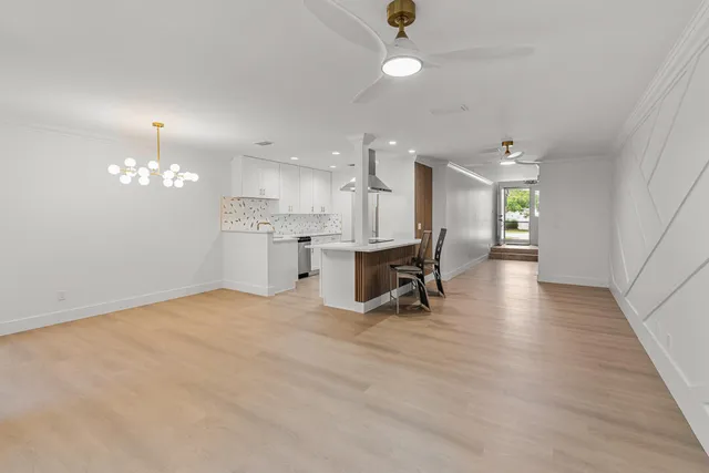 a view of a kitchen with granite countertop natural light