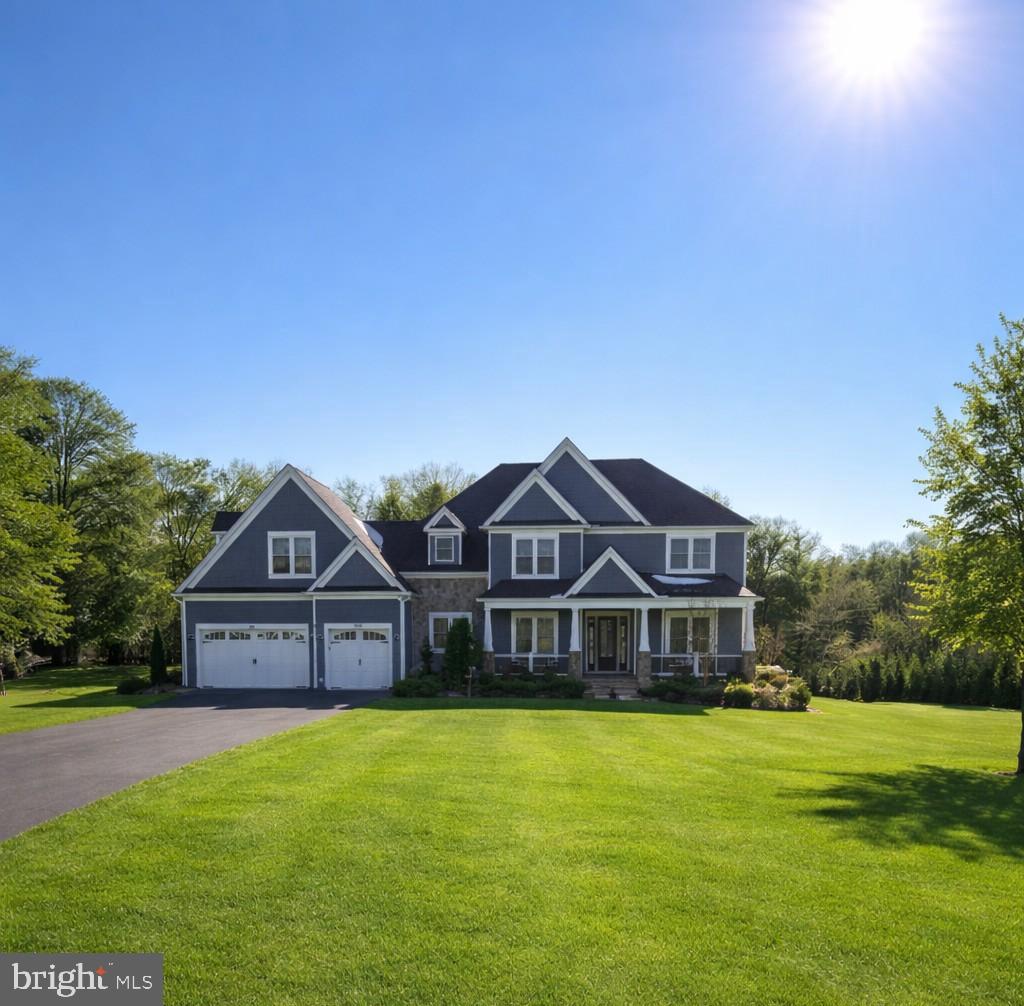 14612 Bristow Road Manassas, VA 20112 - Photo 1 of 12 a front view of a house with a yard and garage