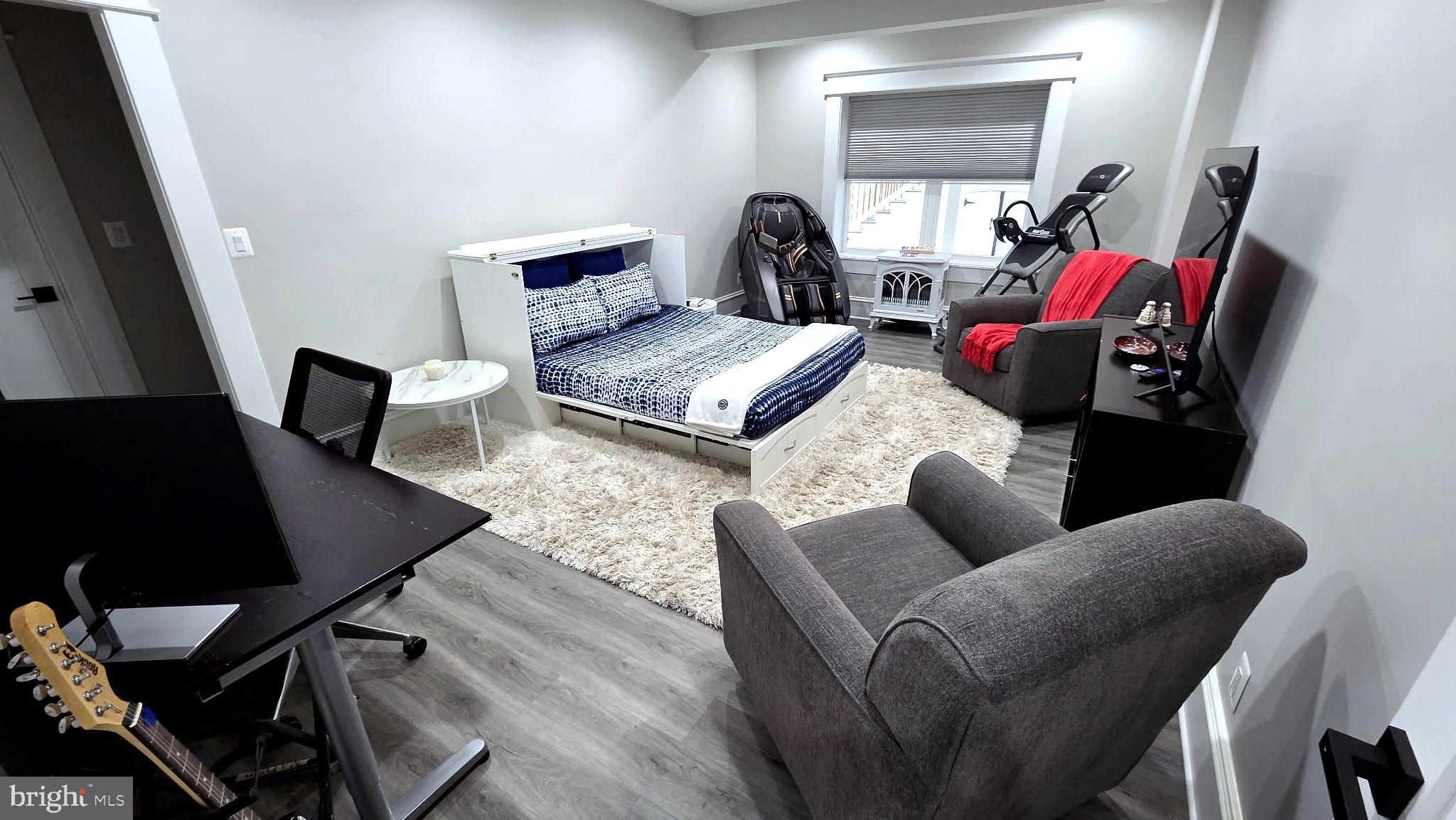 14612 Bristow Road Manassas, VA 20112 - Photo 11 of 12 a living room with furniture and a wooden floor