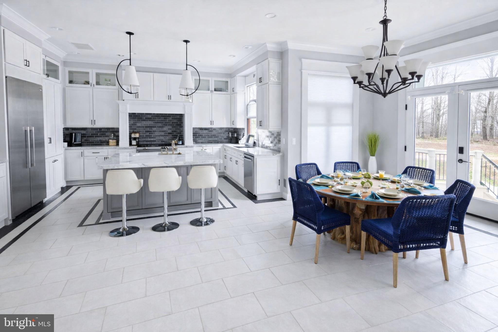 14612 Bristow Road Manassas, VA 20112 - Photo 2 of 12 a living room with furniture a fireplace and a chandelier