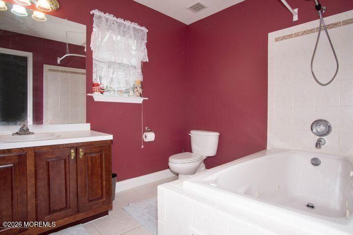 467 Leesville Road Jackson, NJ 08527 - Photo 14 of 19 a bathroom with a sink and a mirror