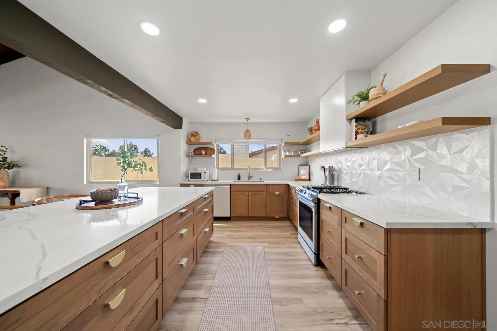 4010 Corral Canyon Road Bonita, CA 91902 - Photo 15 of 35 a large kitchen with stainless steel appliances granite countertop a lot of counter space and wooden floors
