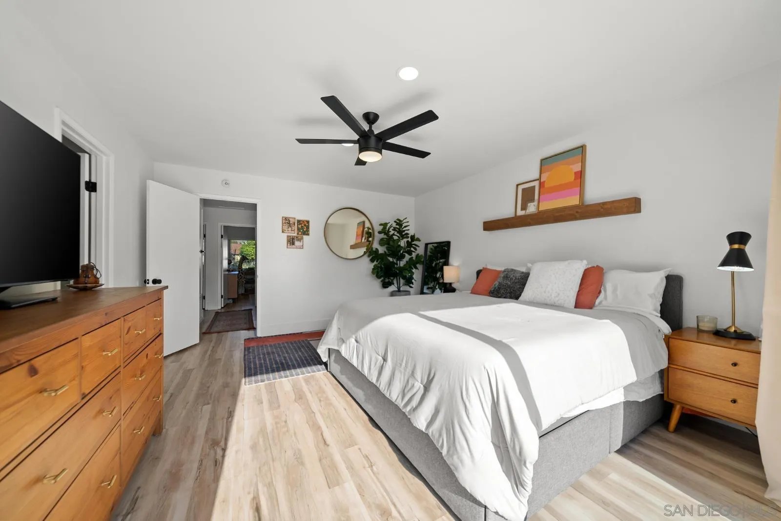 4010 Corral Canyon Road Bonita, CA 91902 - Photo 17 of 35 a spacious bedroom with a bed and a flat screen tv