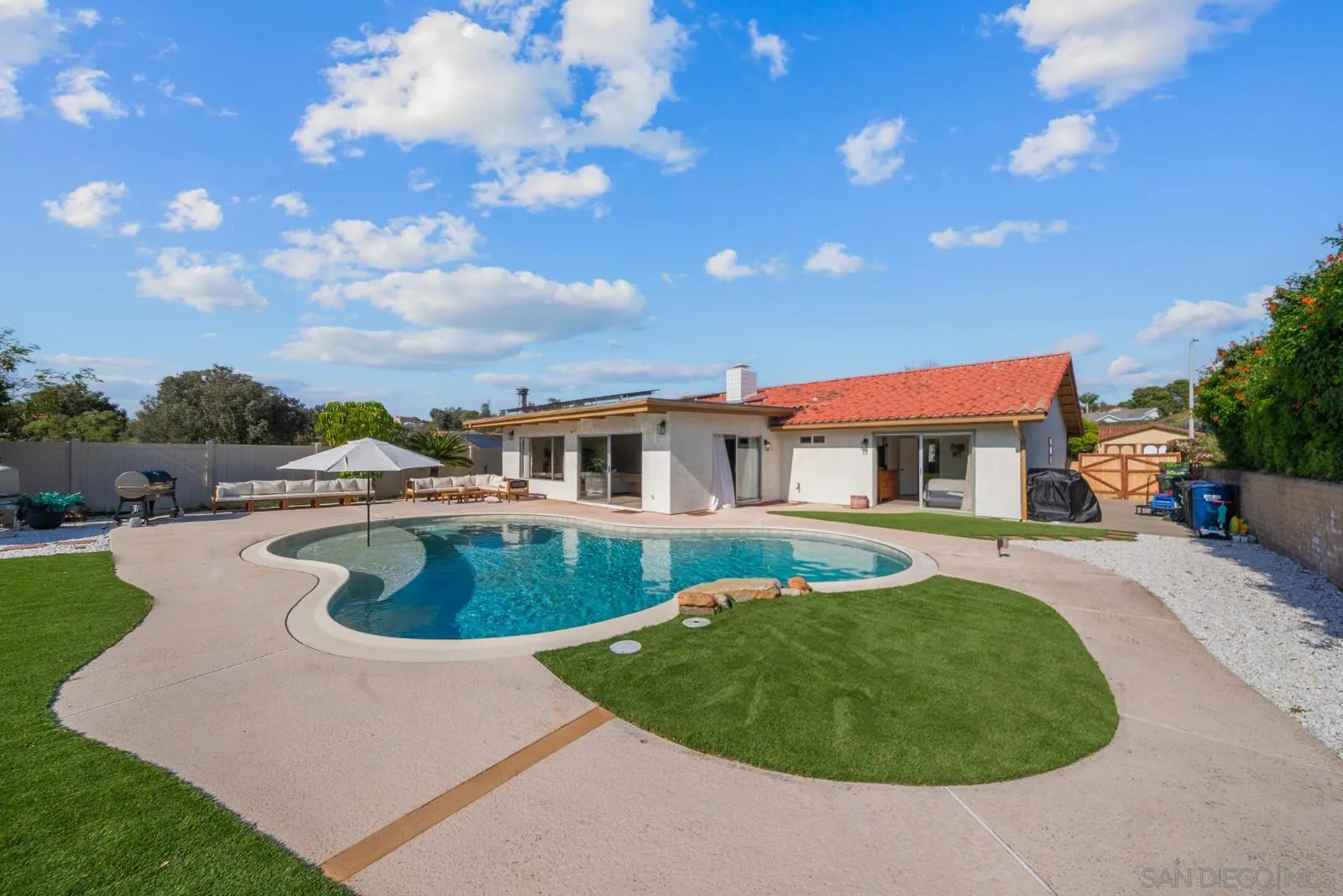 4010 Corral Canyon Road Bonita, CA 91902 - Photo 2 of 35 a swimming pool with outdoor seating and deck