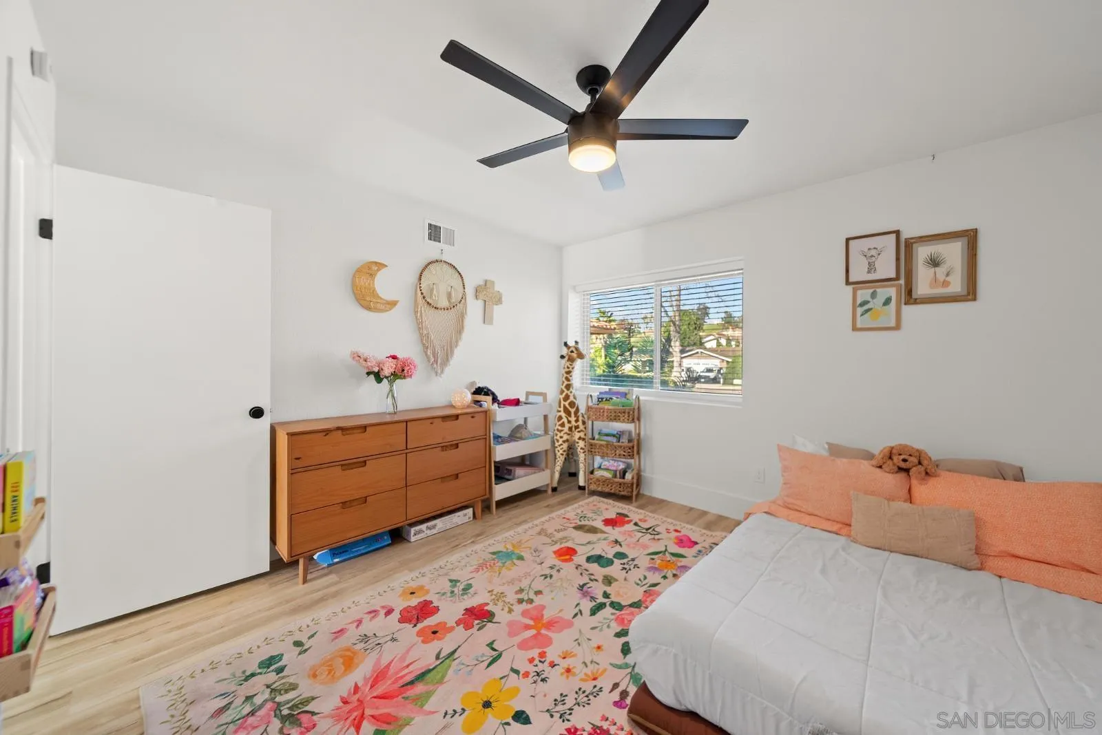 4010 Corral Canyon Road Bonita, CA 91902 - Photo 21 of 35 a bed room with a bed and a dresser